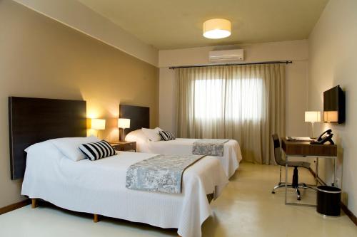 Кровать или кровати в номере Casa Campus Pilar Suites