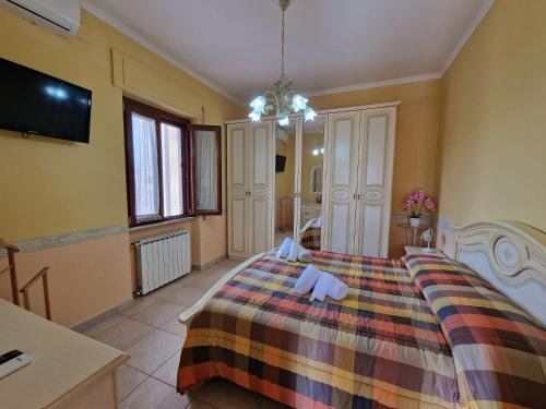 a bedroom with a bed with two teddy bears on it at Vista Mare House in Fiumicino