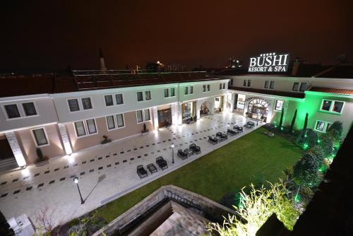 an aerial view of a building at night at Bushi Resort & SPA in Skopje