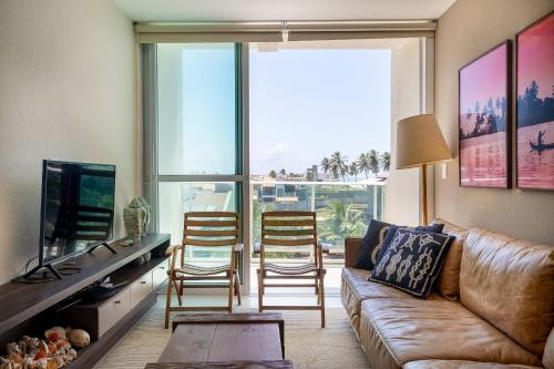 TV a/nebo společenská místnost v ubytování Luxo e conforto pé na areia em Barra de São Miguel