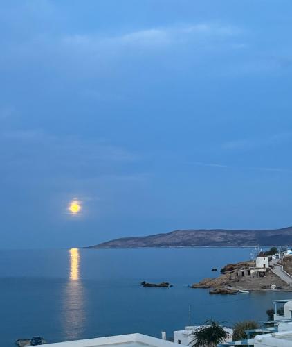 a full moon rising over a body of water at Christina's House in Koufonisia