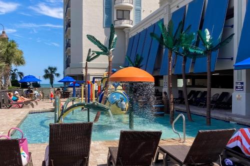 a pool in a hotel with a water park at Oceanfront Paradise in Myrtle Beach