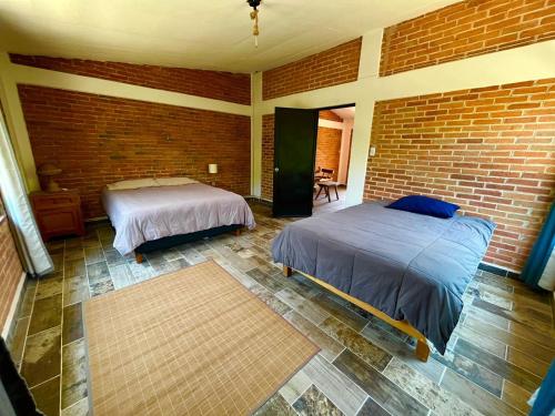 Postel nebo postele na pokoji v ubytování Cabaña Privada en el Campo