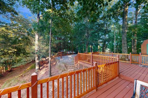 a deck with a wooden fence and trees at View for Two in Ellijay