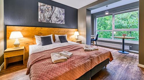 Posteľ alebo postele v izbe v ubytovaní Apartament SPA 44 Resort Kozubnik blisko Szczyrk- 5D Apartamenty