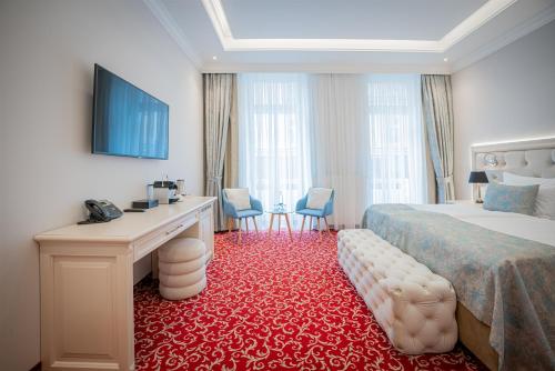 Postel nebo postele na pokoji v ubytování Golden Key Boutique Hotel