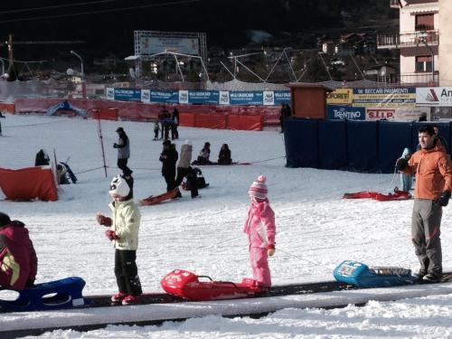 a group of people standing in the snow at Suite Romantica Fuga in Roncone
