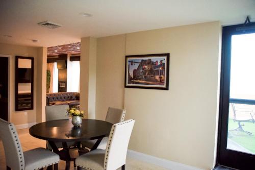 a dining room with a table and chairs at The Americus Hotel, Trademark Collection by Wyndham in Allentown