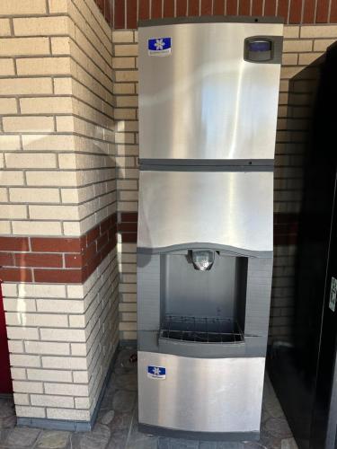 a metal oven in a brick wall at Palace Inn I-45 & Bellfort in Houston
