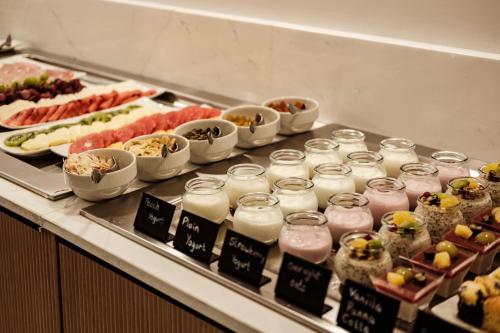 a buffet line with many different types of food at San Karlu in Valletta