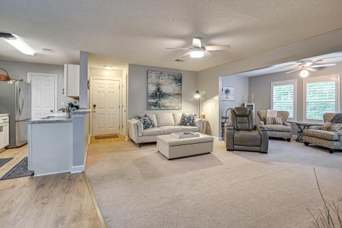 a living room with a couch and a table at 4 Mi to Brookgreen Gardens Murrells Inlet Condo in Myrtle Beach
