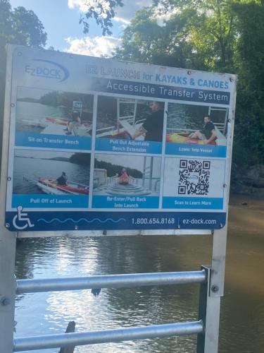a sign on the side of a body of water at Farm in Stockbridge