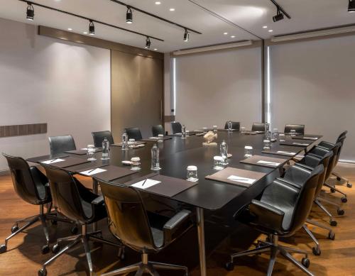 a large conference room with a large table and chairs at Radisson Blu Hotel Istanbul Ottomare in Istanbul