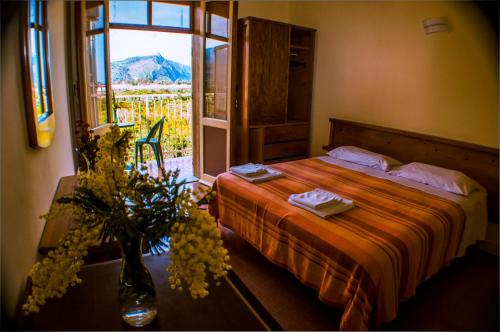 מיטה או מיטות בחדר ב-Hotel-Pensione 4 Stagioni