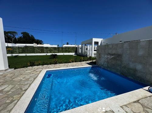 a swimming pool in the backyard of a house at villa green paradise in San Felipe de Puerto Plata