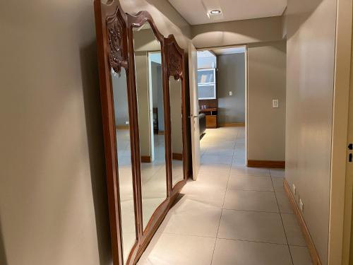 a hallway with a row of mirrors on a wall at Excelente ubicación, cerca Arístides, cochera gratis in Mendoza