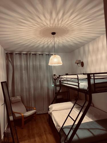 a bedroom with two bunk beds and a ceiling at Antojos in Tardajos