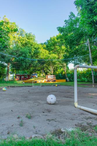 a soccer ball on the ground next to a goal at Cabañas Los Venaos in San Bernardo del Viento