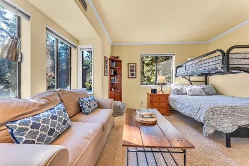 a living room with a couch and a bunk bed at The Big Bear Chalet Private Hot Tub in Carnelian Bay