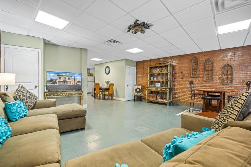 a living room with two couches and a tv at Dallas Farmers Market Apartment, Just right in Downtown DALLAS TX Perfect Place in Dallas