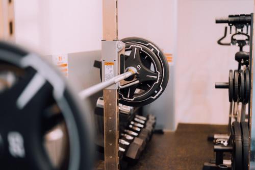 a gym with several rows of exercise equipment at Minimalist Loft Namba Compact Studio with a 24-hour Gym MA401 in Osaka
