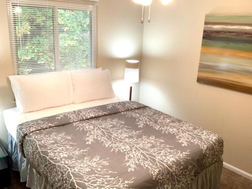 a small bedroom with a bed with a window at The House Hotels- E. Turkeyfoot #1 in Akron