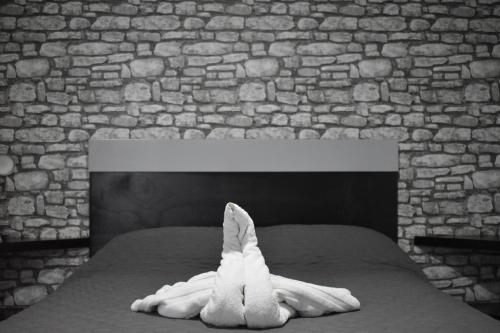 a towel animal sitting on top of a bed at El Suburbio - Morelos Sur in Morelia