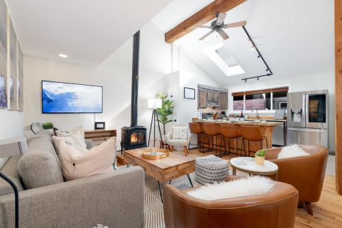 a living room filled with furniture and a kitchen at Spacious Family Friendly Townhome on Telluride Mainstreet in Telluride