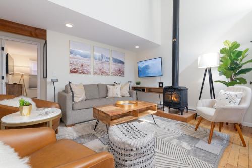 a living room with a couch and a fireplace at Spacious Family Friendly Townhome on Telluride Mainstreet in Telluride