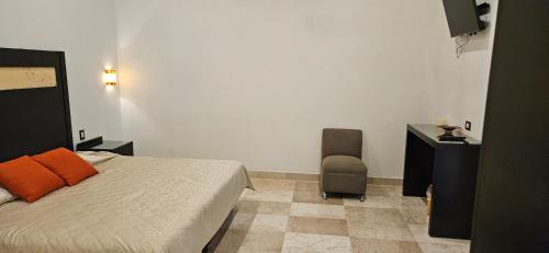 Postel nebo postele na pokoji v ubytování Nonó Hotel