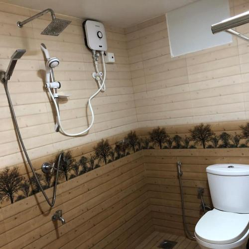 a bathroom with a shower and a toilet at Siri Villa Habaraduwa in Habaraduwa