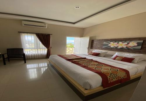 Postel nebo postele na pokoji v ubytování Batukaru Garden 5 Bali Sevilla Residence