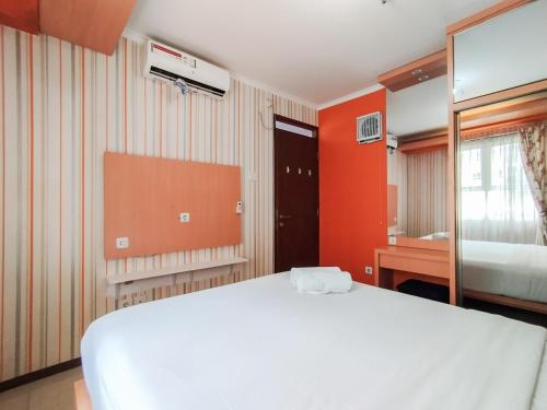 Ένα ή περισσότερα κρεβάτια σε δωμάτιο στο Brand New 2BR Apartment Gateway Pasteur By Travelio