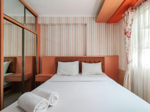 Ένα ή περισσότερα κρεβάτια σε δωμάτιο στο Brand New 2BR Apartment Gateway Pasteur By Travelio