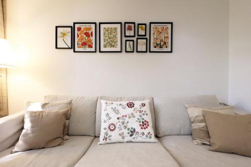 a white couch with pillows in a living room at Modern Comfort Near Castle St with WiFi & Parking! in Taunton