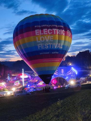 a colorful hot air balloon at a festival at night at Guggenthaler Gipfelblick in Guggenthal