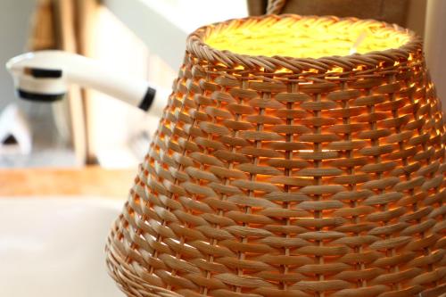 a wicker basket sitting on top of a sink at Minamiboso Asian Garden Villa Shirahama in Minamiboso