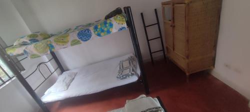 an overhead view of a bedroom with a bunk bed at Finca Las Hamacas- La Posada del pensamiento in Santa Beatríz