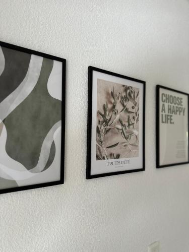 four framed pictures hanging on a wall at Handelshaus in Meppen