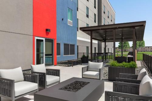 a patio with chairs and tables and a gazebo at avid hotel North Platte by IHG in North Platte