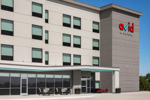 an office building with a sign on it at avid hotel North Platte by IHG in North Platte