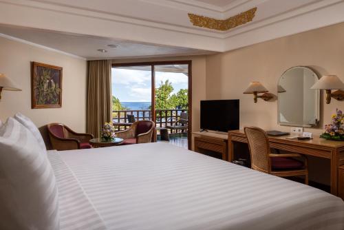 Un ou plusieurs lits dans un hébergement de l'établissement Prama Sanur Beach Bali