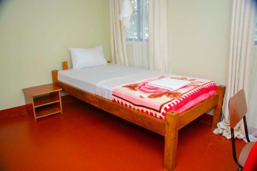 Postel nebo postele na pokoji v ubytování Shamba Hostel