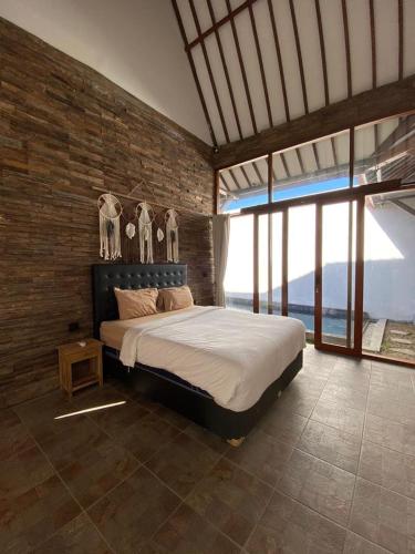 Ένα ή περισσότερα κρεβάτια σε δωμάτιο στο Mangrove Bali Villa