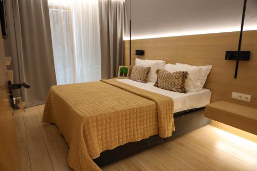 Una cama o camas en una habitación de Hotel Kardinal