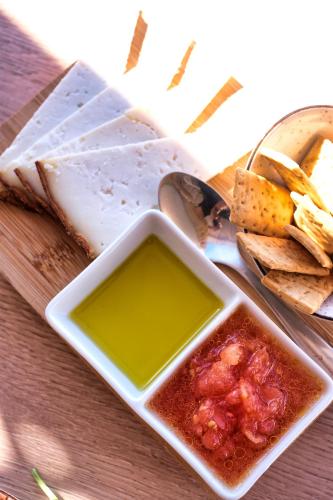 a plate of food with a bowl of salsa and dips at Casa Serena 10 Boutique- Adults Only-Breakfast Included in Mácher