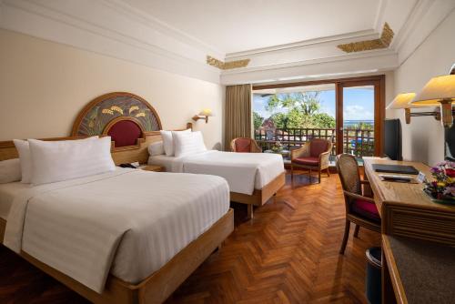 Кровать или кровати в номере Prama Sanur Beach Bali