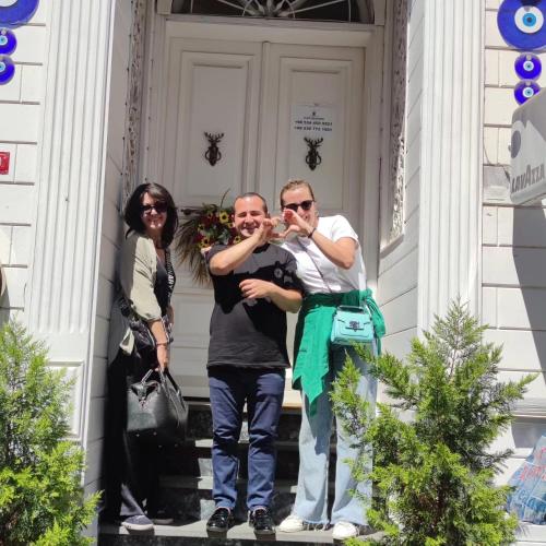 two people standing on the steps of a building at Solomon's Mansion Hotel Istanbul in Istanbul