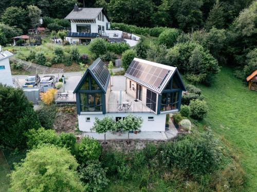 an aerial view of a house with a solar roof at Taunus Tinyhouse in Weilrod