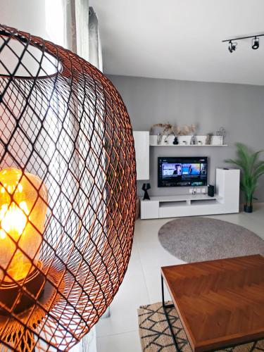 a living room with a large wicker sphere at Bliss in Fgura